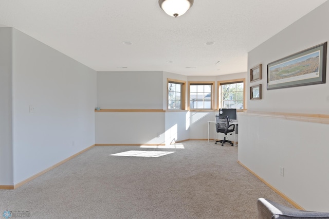 unfurnished office with carpet and baseboards