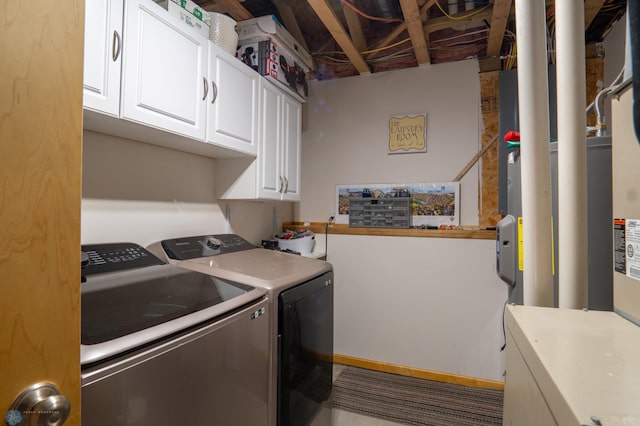 washroom with independent washer and dryer and cabinet space