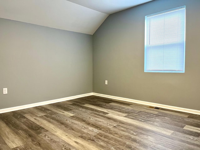 2616 30th Ave S, Minneapolis, MN 55406 - bonus room with lofted ceiling, dark wood-type flooring, and baseboards