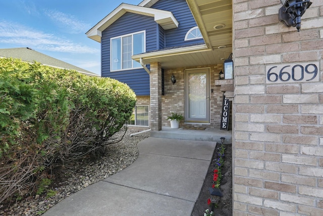 6609 91st Trl N, Brooklyn Park, MN 55445 - doorway to property with brick siding