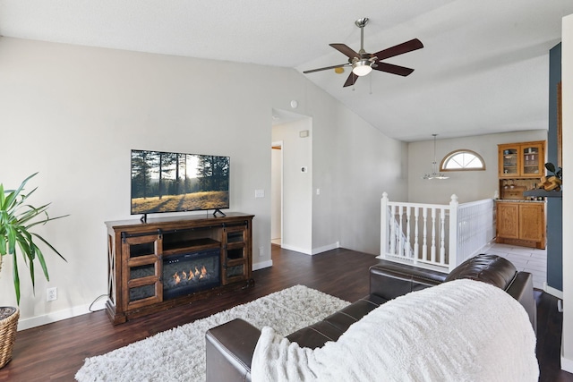 6609 91st Trl N, Brooklyn Park, MN 55445 - living room featuring ceiling fan, lofted ceiling, wood finished floors, baseboards, and a glass covered fireplace