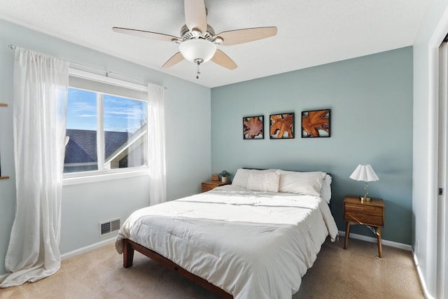 6609 91st Trl N, Brooklyn Park, MN 55445 - bedroom with light carpet, baseboards, and ceiling fan