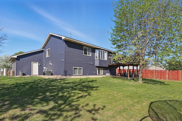 6609 91st Trl N, Brooklyn Park, MN 55445 - rear view of property with a wooden deck and cooling unit