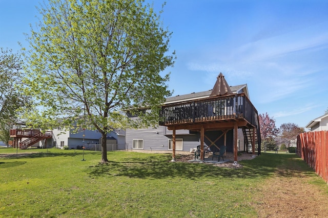 6609 91st Trl N, Brooklyn Park, MN 55445 - rear view of house with stairs, a wooden deck, and a sunroom