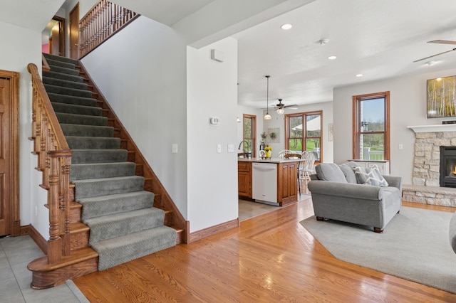 6715 Eldorado Way, Leon Twp, MN 55009 - living area featuring a ceiling fan, stairs, a fireplace, light wood-type flooring, and recessed lighting