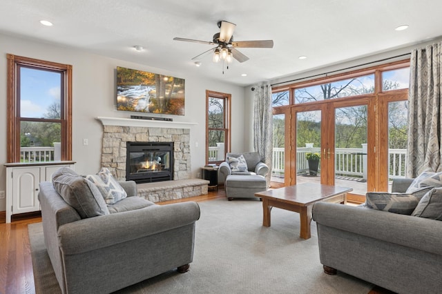 6715 Eldorado Way, Leon Twp, MN 55009 - living area featuring a ceiling fan, plenty of natural light, a fireplace, recessed lighting, and wood finished floors