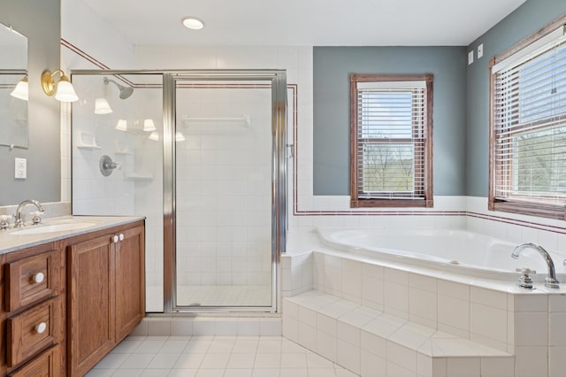 6715 Eldorado Way, Leon Twp, MN 55009 - bathroom featuring a shower stall, vanity, a garden tub, and tile patterned floors