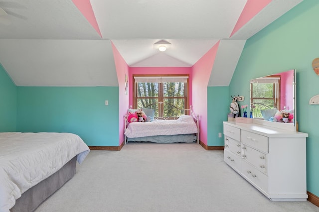 6715 Eldorado Way, Leon Twp, MN 55009 - bedroom with lofted ceiling, light carpet, and baseboards