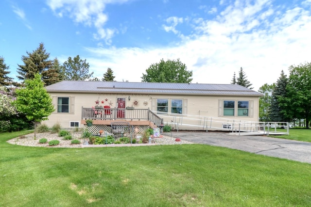 33397 Pickerel View Dr, Richville, MN 56576 - view of front of home featuring a deck, a front lawn, and metal roof