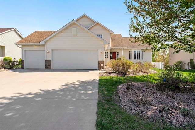 2578 148th St W, Rosemount, MN 55068 - traditional home with an attached garage, driveway, fence, and a shingled roof