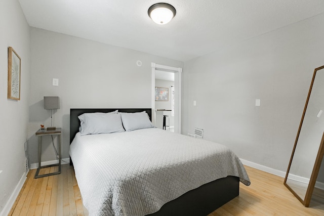 1541 Charles Ave, Saint Paul, MN 55104 - bedroom with light wood-style floors and baseboards
