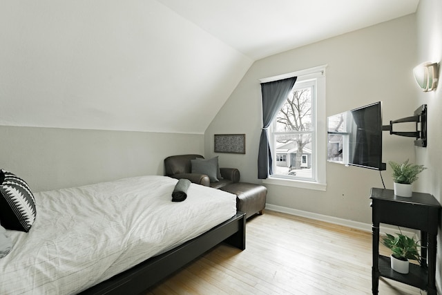 1541 Charles Ave, Saint Paul, MN 55104 - bedroom with light wood-type flooring, lofted ceiling, and baseboards