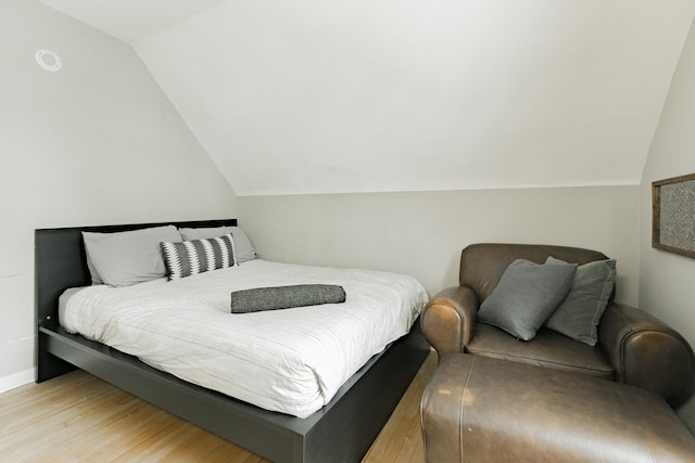 1541 Charles Ave, Saint Paul, MN 55104 - bedroom with vaulted ceiling, light wood-style flooring, and baseboards