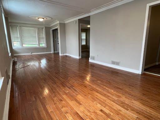 1541 Charles Ave, Saint Paul, MN 55104 - unfurnished room featuring crown molding, wood-type flooring, and baseboards