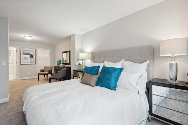 carpeted bedroom with baseboards