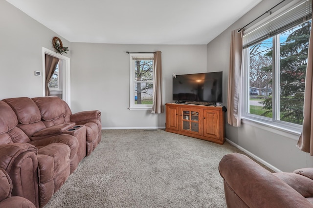 110 7th St SE, Little Falls, MN 56345 - living room featuring light carpet and baseboards
