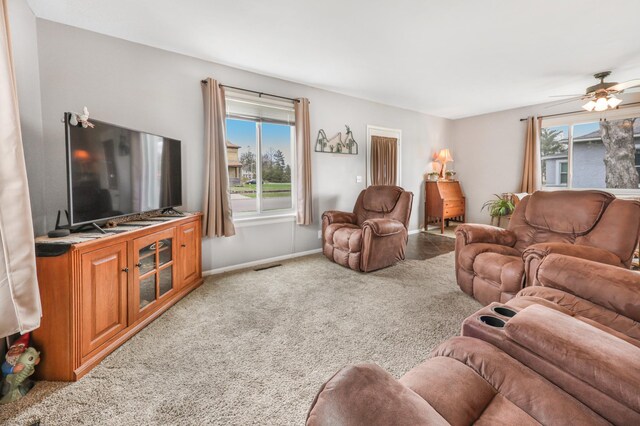 110 7th St SE, Little Falls, MN 56345 - carpeted living area featuring ceiling fan and baseboards
