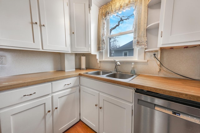 110 7th St SE, Little Falls, MN 56345 - kitchen featuring dishwasher, a sink, white cabinets, and open shelves