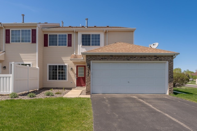 9277 Inland Ln N, Maple Grove, MN 55311 - view of front facade with driveway and an attached garage