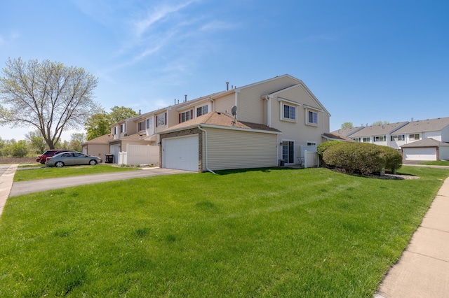 9277 Inland Ln N, Maple Grove, MN 55311 - view of home's exterior with driveway and a yard