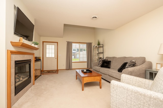 9277 Inland Ln N, Maple Grove, MN 55311 - living area featuring a fireplace, light colored carpet, and baseboards