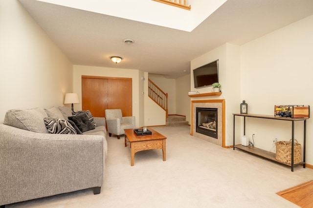 9277 Inland Ln N, Maple Grove, MN 55311 - living area featuring stairs, carpet flooring, and a tiled fireplace
