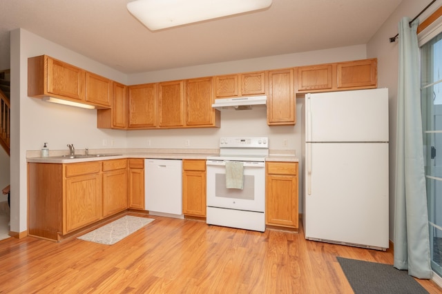 9277 Inland Ln N, Maple Grove, MN 55311 - kitchen featuring white appliances, under cabinet range hood, a sink, and light countertops
