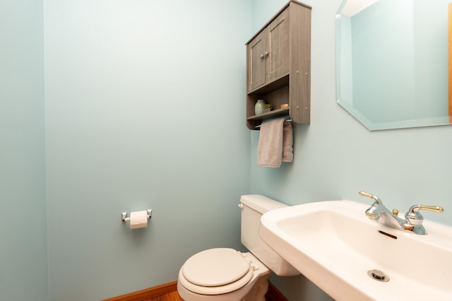 9277 Inland Ln N, Maple Grove, MN 55311 - half bathroom with a sink and toilet