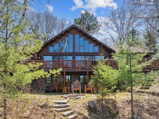 15464 Birch Narrows Rd, Crosslake, MN 56472 - rear view of property with a deck, log siding, and stone siding