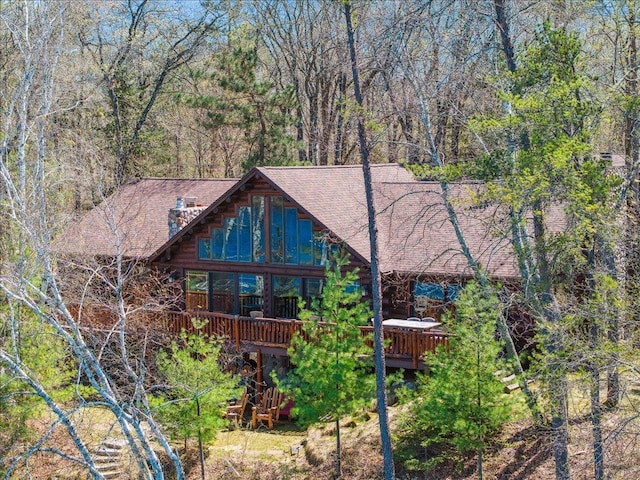 15464 Birch Narrows Rd, Crosslake, MN 56472 - view of front of house with a wooden deck and a shingled roof