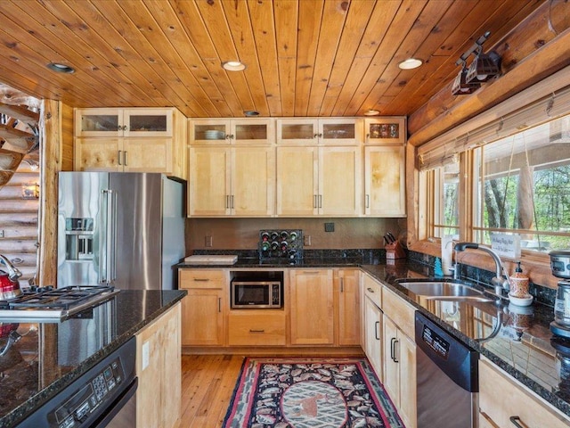 15464 Birch Narrows Rd, Crosslake, MN 56472 - kitchen featuring stainless steel appliances, rustic walls, wooden ceiling, light wood-type flooring, and dark stone countertops