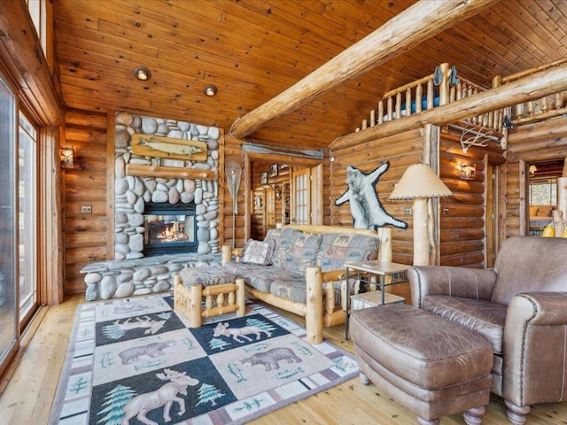 15464 Birch Narrows Rd, Crosslake, MN 56472 - living area with log walls, hardwood / wood-style flooring, wood ceiling, and a fireplace