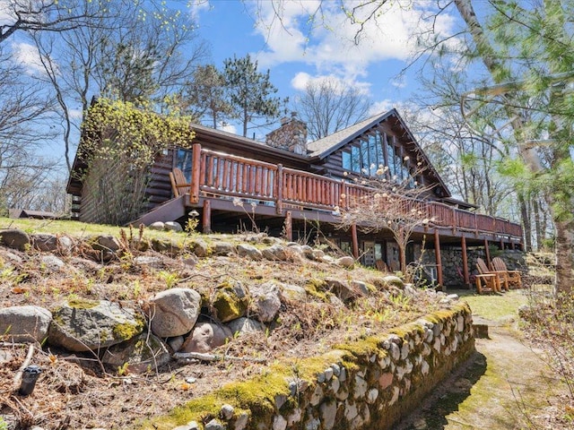15464 Birch Narrows Rd, Crosslake, MN 56472 - back of house with a deck, a chimney, and log exterior