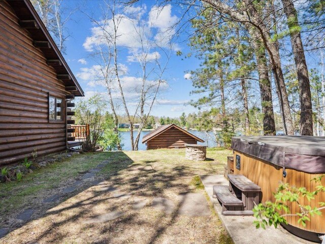 15464 Birch Narrows Rd, Crosslake, MN 56472 - view of yard featuring a hot tub and a water view
