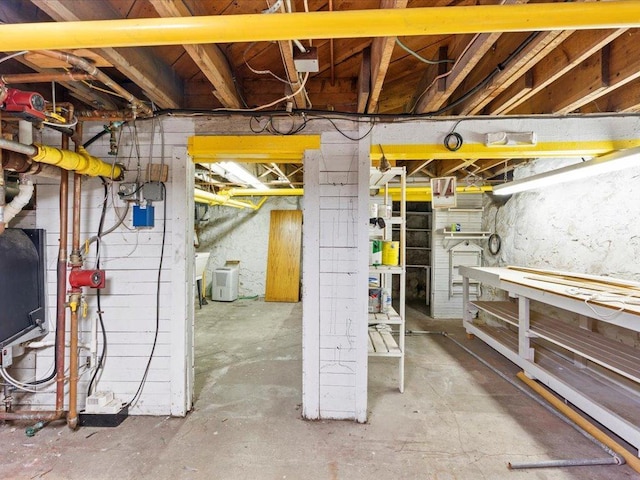unfinished basement with a workshop area