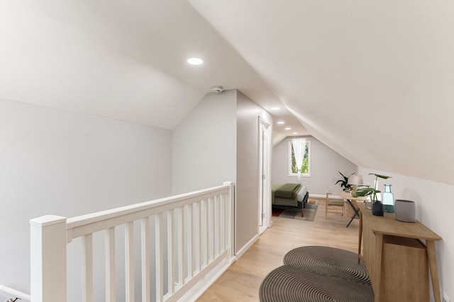 bonus room with vaulted ceiling, light wood-type flooring, recessed lighting, and baseboards