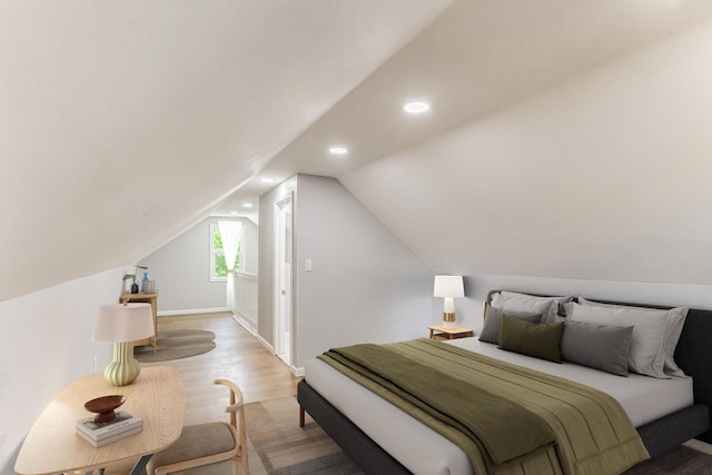 bedroom with wood finished floors, recessed lighting, and vaulted ceiling