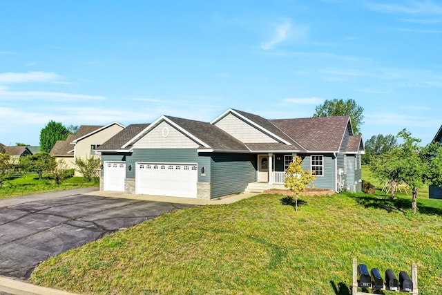 809 3rd Ave SE, Cold Spring, MN 56320 - view of front of property with an attached garage, a front yard, a porch, and driveway