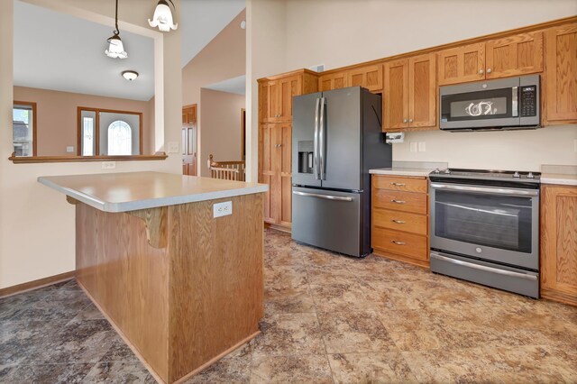809 3rd Ave SE, Cold Spring, MN 56320 - kitchen featuring stainless steel appliances, light countertops, a kitchen bar, and high vaulted ceiling