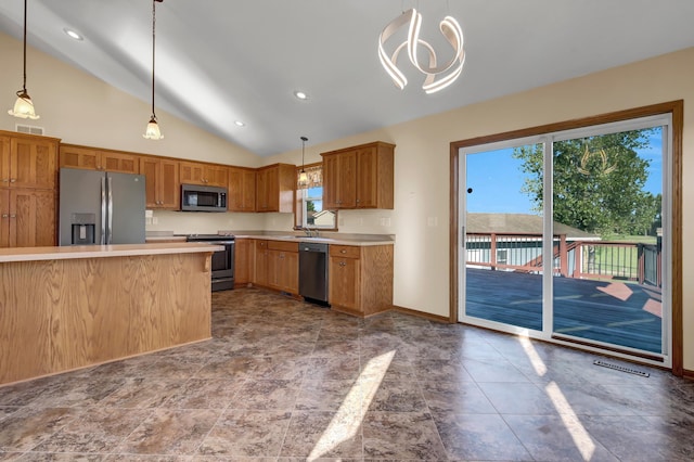 809 3rd Ave SE, Cold Spring, MN 56320 - kitchen with appliances with stainless steel finishes, light countertops, pendant lighting, brown cabinetry, and baseboards