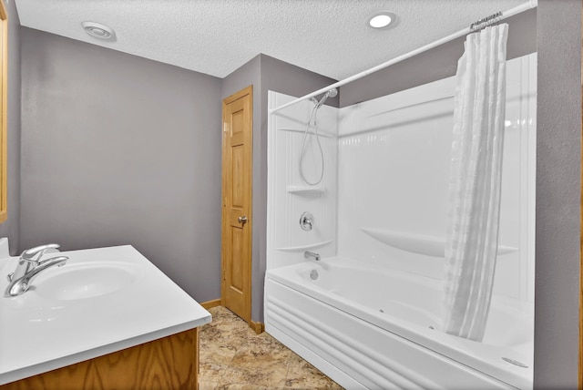 809 3rd Ave SE, Cold Spring, MN 56320 - bathroom featuring a textured ceiling, shower / tub combo, baseboards, and vanity