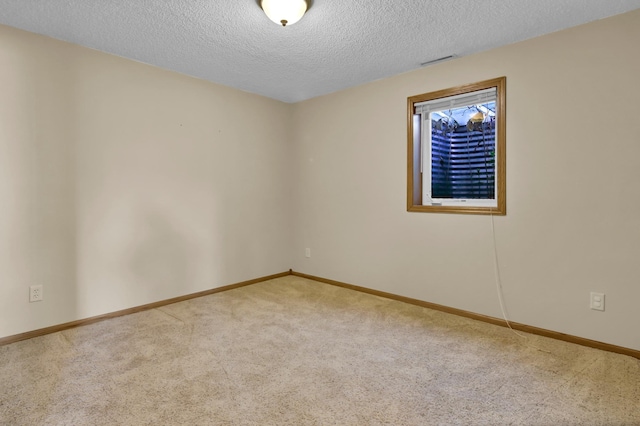 809 3rd Ave SE, Cold Spring, MN 56320 - unfurnished room with carpet flooring, a textured ceiling, and baseboards