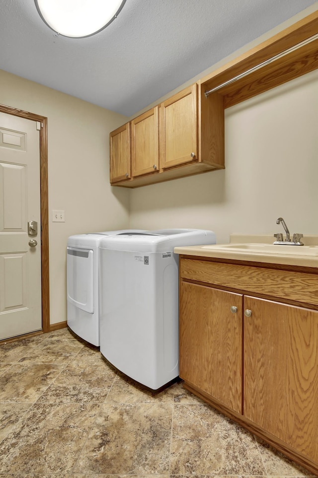 809 3rd Ave SE, Cold Spring, MN 56320 - laundry room featuring cabinet space, separate washer and dryer, and stone finish floors
