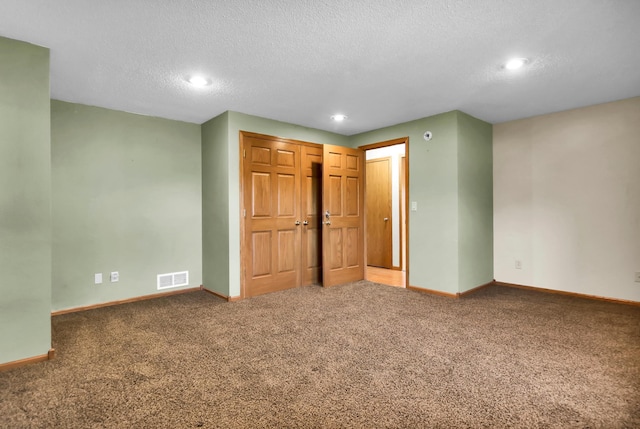 809 3rd Ave SE, Cold Spring, MN 56320 - unfurnished bedroom featuring baseboards, carpet, a textured ceiling, recessed lighting, and a closet