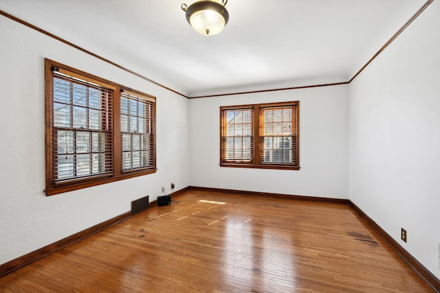 5028-5030 Nicollet Ave S, Minneapolis, MN 55419 - empty room with wood-type flooring, baseboards, and crown molding
