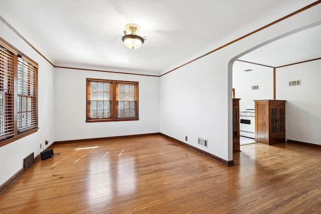5028-5030 Nicollet Ave S, Minneapolis, MN 55419 - unfurnished room with wood finished floors, arched walkways, and baseboards