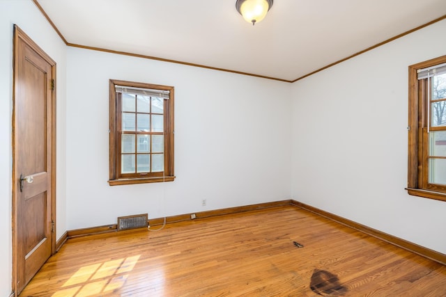 5028-5030 Nicollet Ave S, Minneapolis, MN 55419 - spare room with light wood-type flooring, crown molding, and baseboards