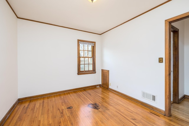 5028-5030 Nicollet Ave S, Minneapolis, MN 55419 - spare room with ornamental molding, hardwood / wood-style floors, and baseboards