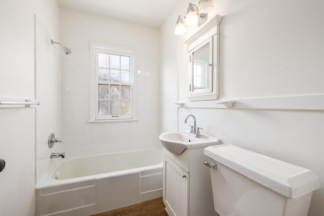 5028-5030 Nicollet Ave S, Minneapolis, MN 55419 - bathroom featuring toilet, tub / shower combination, vanity, and wood finished floors