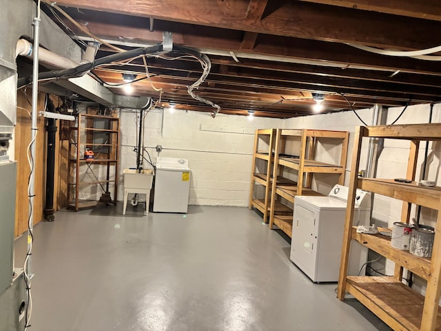 5028-5030 Nicollet Ave S, Minneapolis, MN 55419 - unfinished basement featuring washing machine and clothes dryer, a sink, and concrete block wall